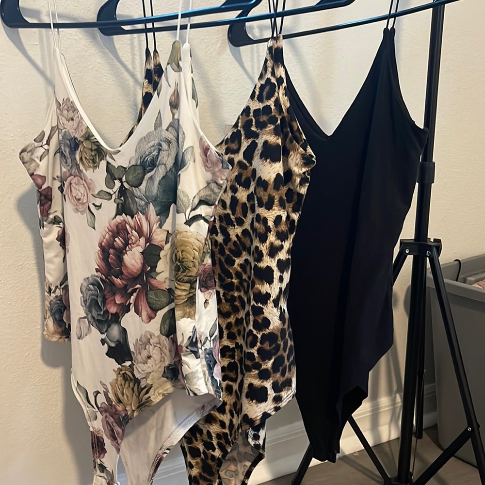 Three size small body suits